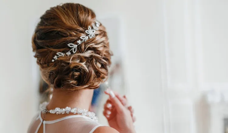 Bride with elegant updo and hair jewellery.