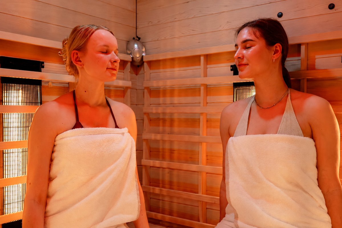 Modern infrared cabin with a view into the interior is located in the light-flooded wellness area of the Rugard Thermal Strandhotel.
