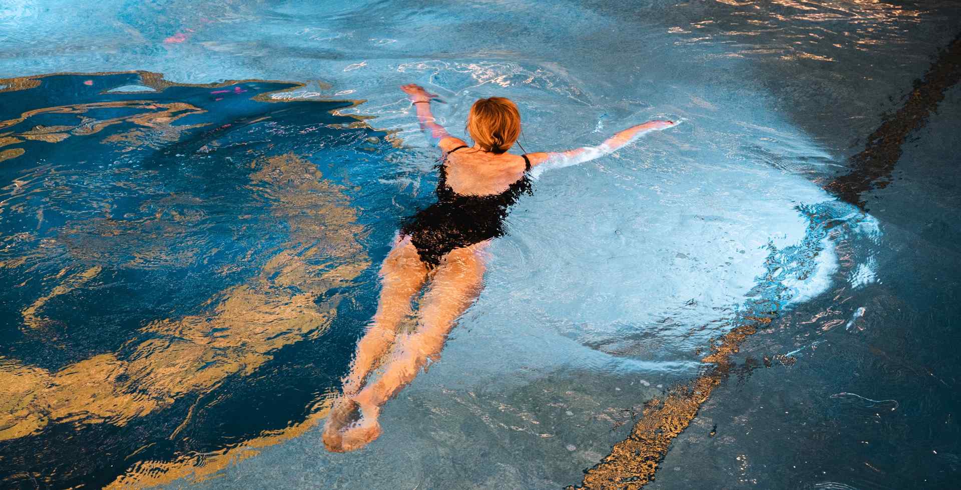 Guest enjoying the indoor pool at Rugard Thermal Strandhotel in Binz on Rügen island.